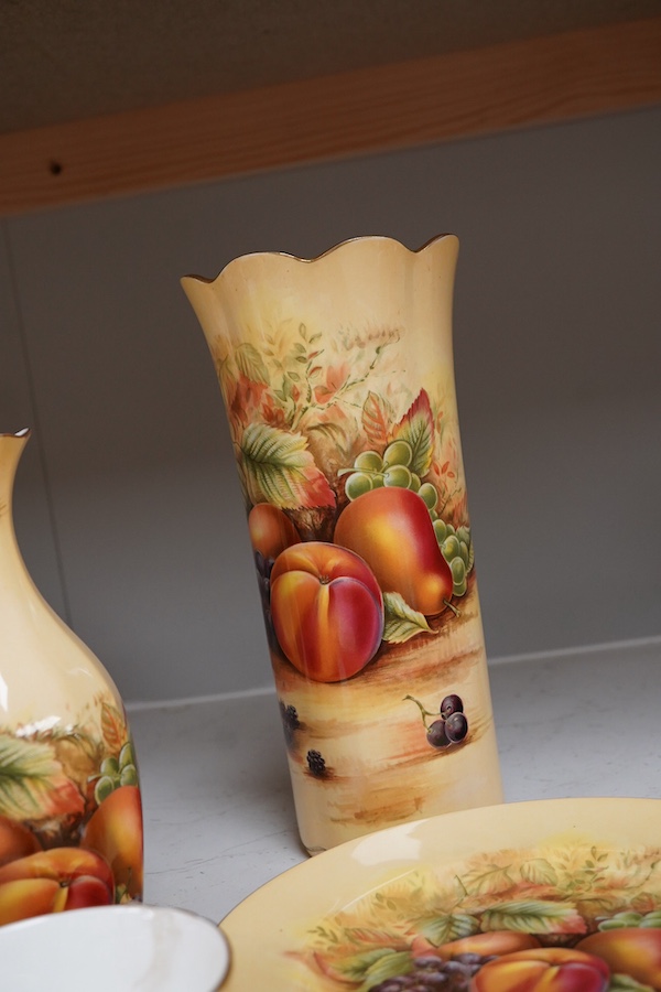 A collection of Aynsley Orchard Gold wares including a timepiece, vases, etc. tallest 23cm